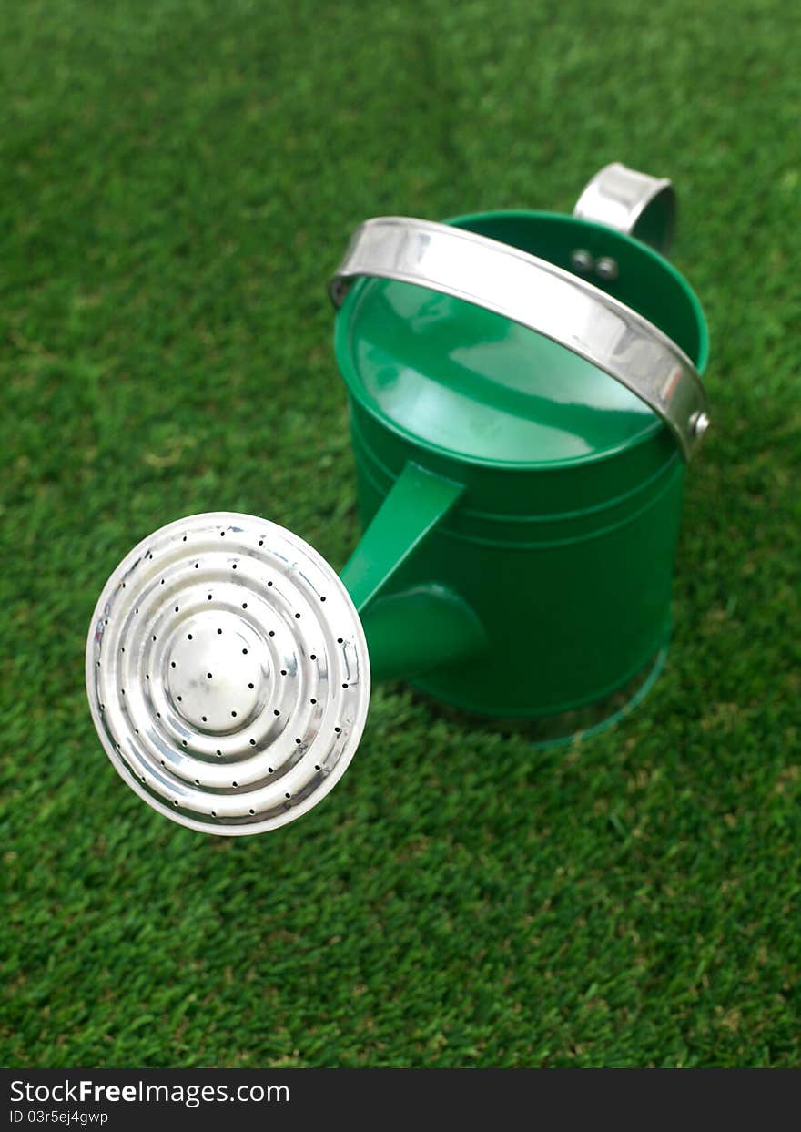 A watering can against a white background