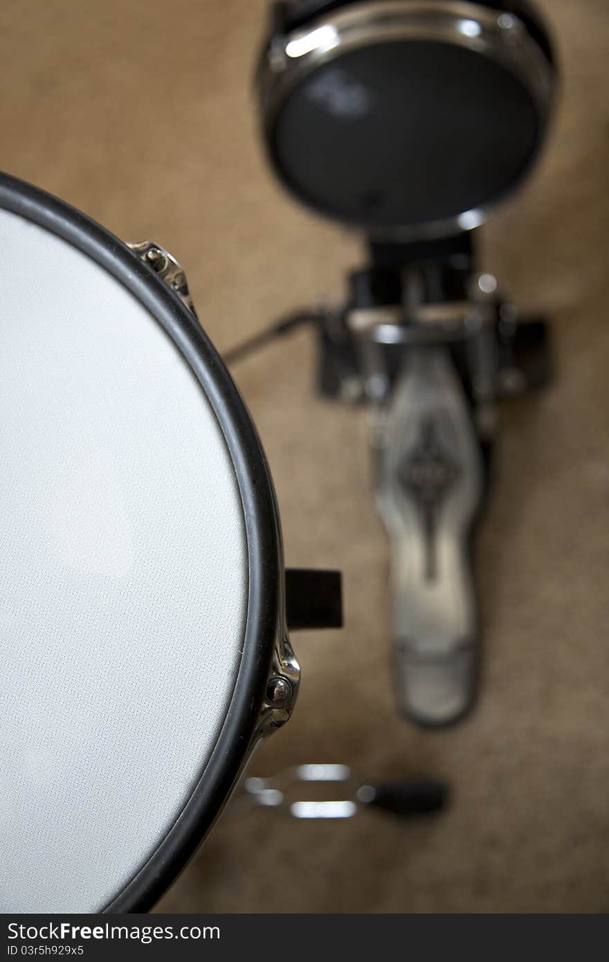 The snare and bass drum of an electronic drum set. The snare and bass drum of an electronic drum set