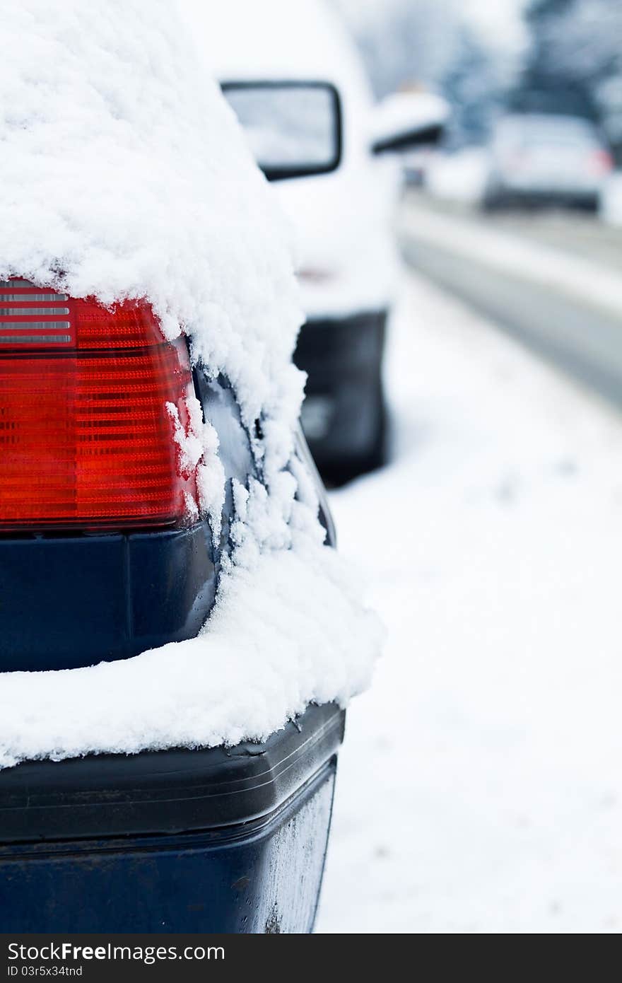 Car covered in snow on street