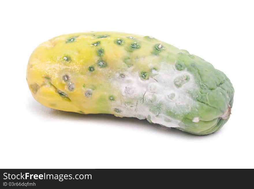 The rotting cucumber on a white background