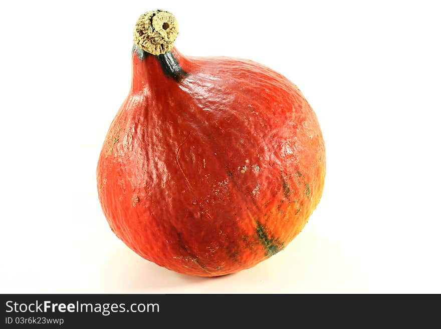 A Hokkaido pumpkin on a white background