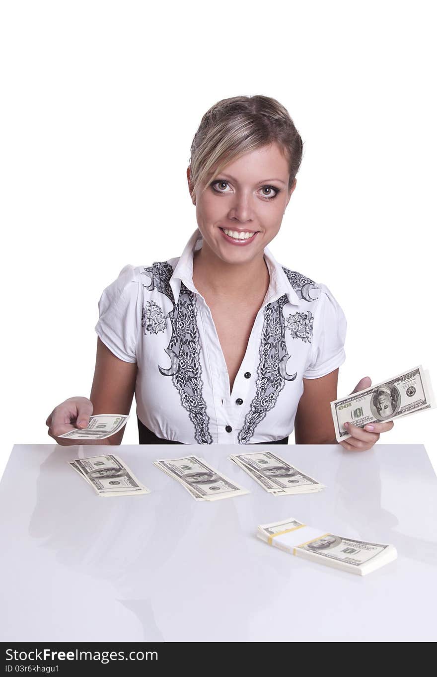 Business woman sitting at the table and counts the money isolated on white. Business woman sitting at the table and counts the money isolated on white