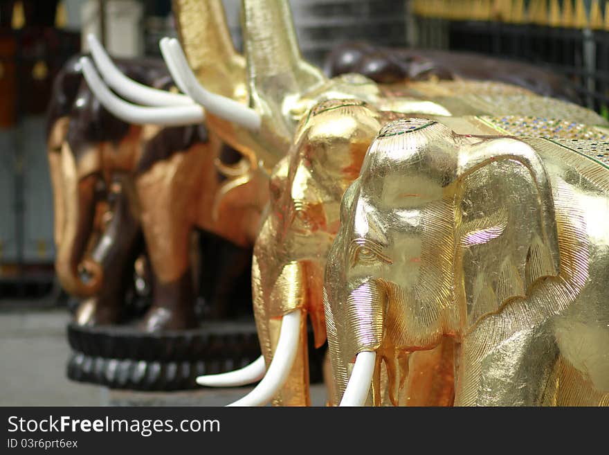 Wooden gilded elephants at Erawan shrine, Bangkok, Thailand. Wooden gilded elephants at Erawan shrine, Bangkok, Thailand