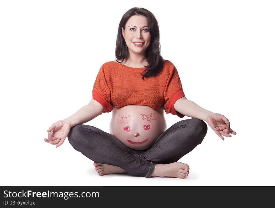 A pregnant woman with a picture on the belly isolated on white