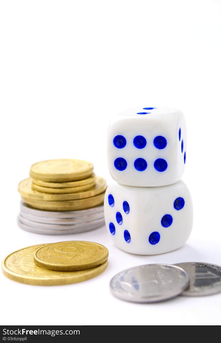 Dice and coins on a white background. Dice and coins on a white background