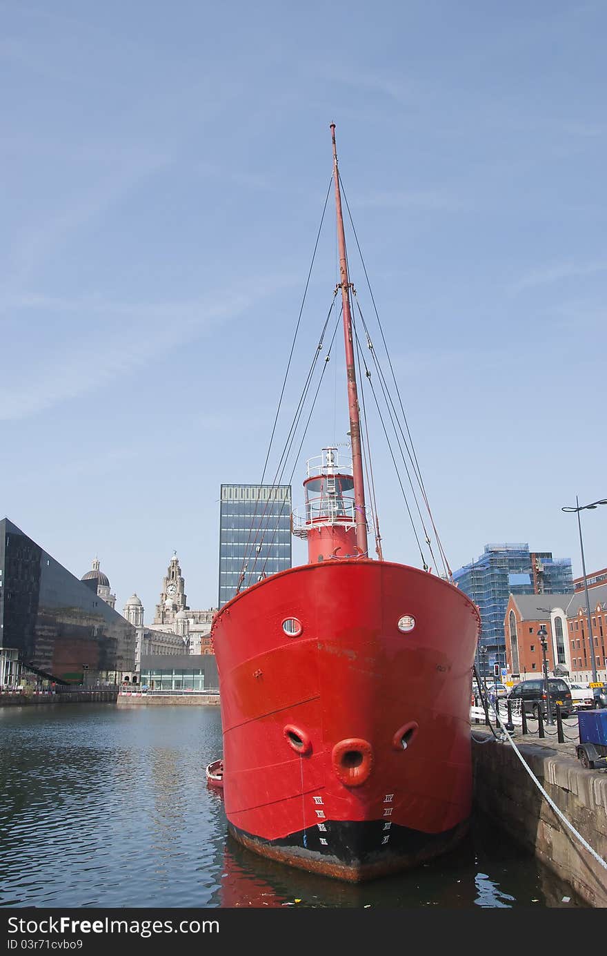 The Bows and Light of a Red Lightship in a English Dock