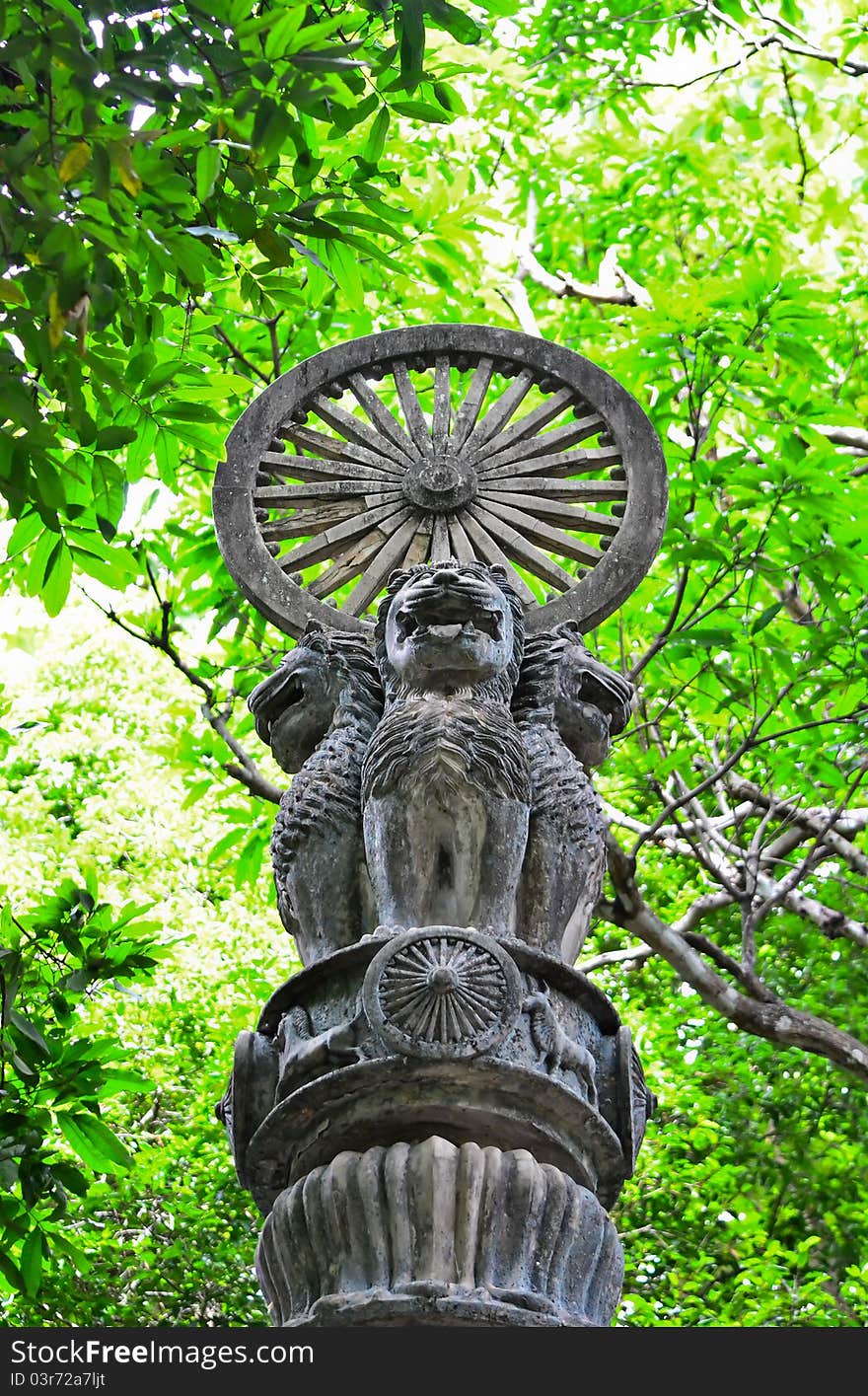 Lion and wheel statue