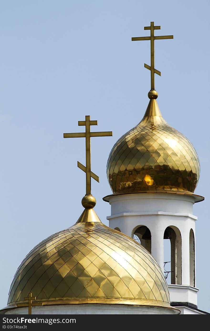 The dome of the Christian church covered with gold in the sunlight. The dome of the Christian church covered with gold in the sunlight