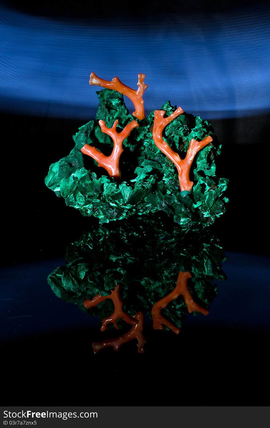 Malachite and coral jewerly compozition on black background