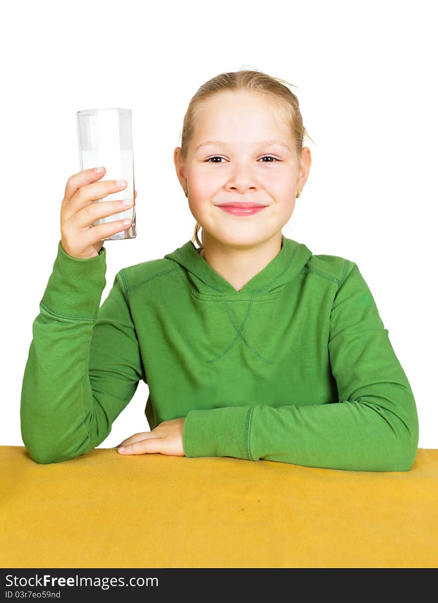 Happy little girl with a glass of milk, isolated over white