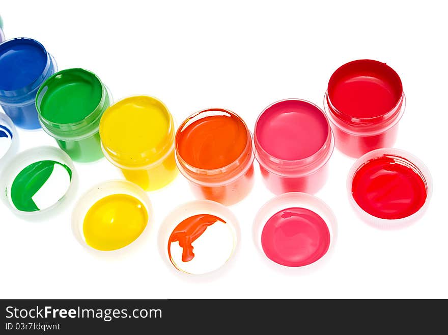 Multi-colored gouache paint isolated on a white background