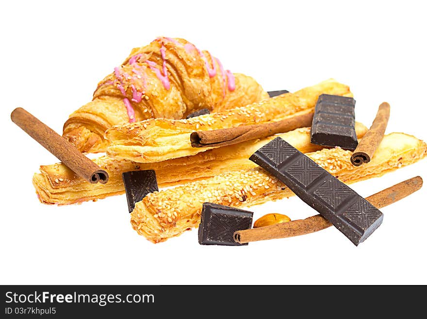 Crispy sticks with sesame and croissant on white background