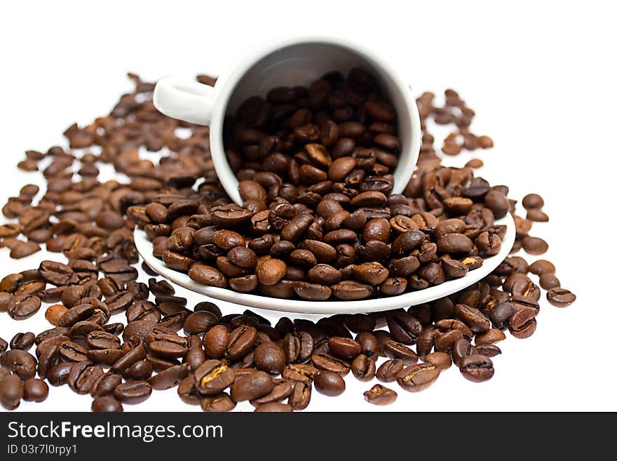 Coffee beans in a cup isolated on white