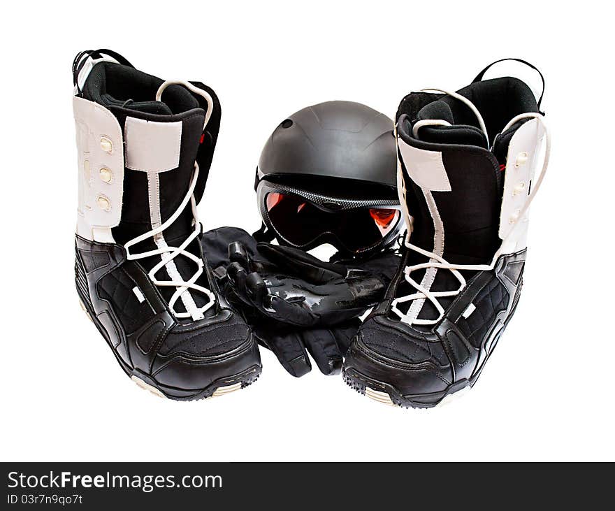 Snowboard boots, helmet, gloves, glasses on a white background.