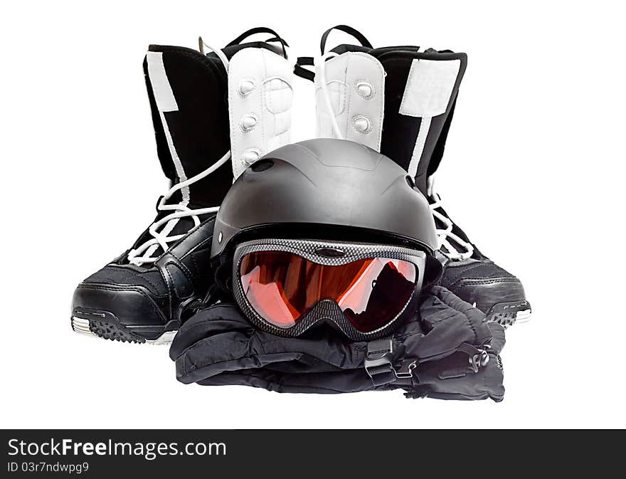 Snowboard boots, helmet, gloves, glasses on a white background.