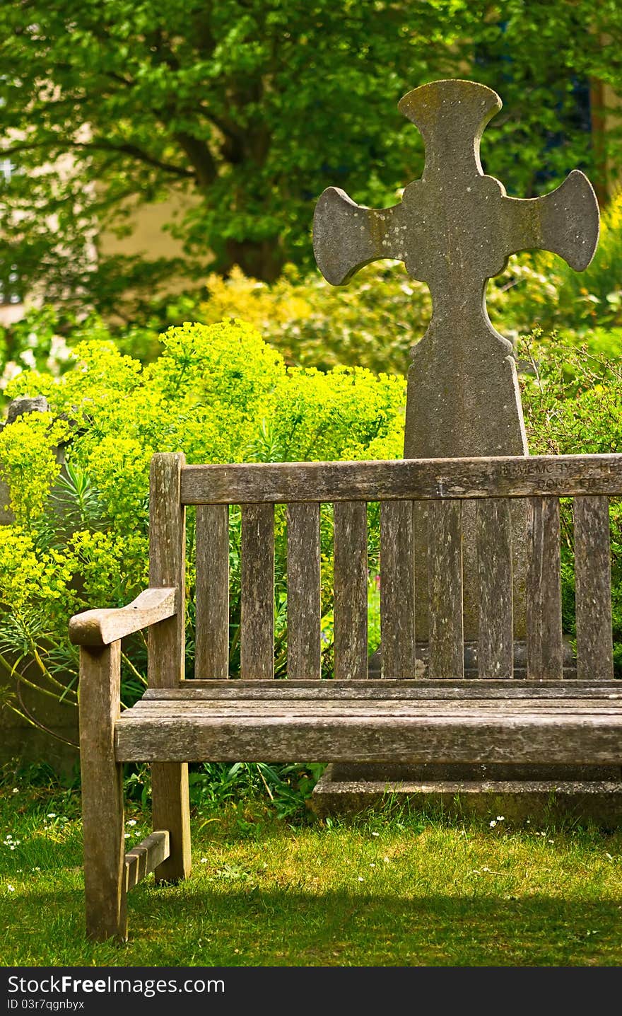 Rustical bench in blossom graveyard