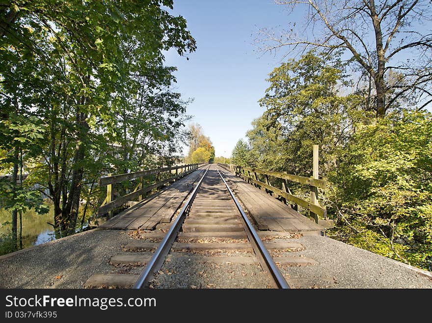 Train Track on Wooden Bridge over River in Oregon