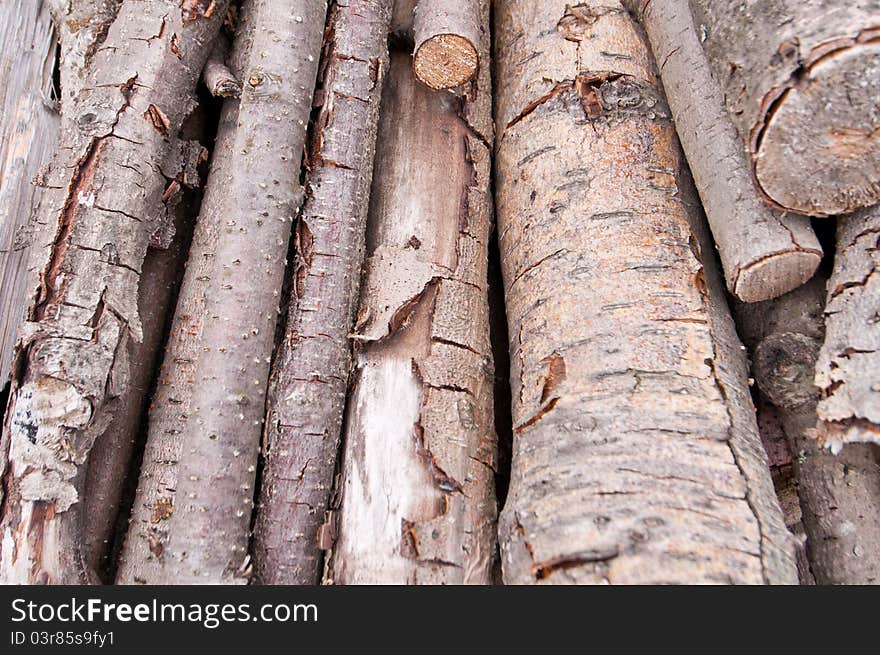 Stack of cut wooden logs showing detail and texture. Stack of cut wooden logs showing detail and texture.