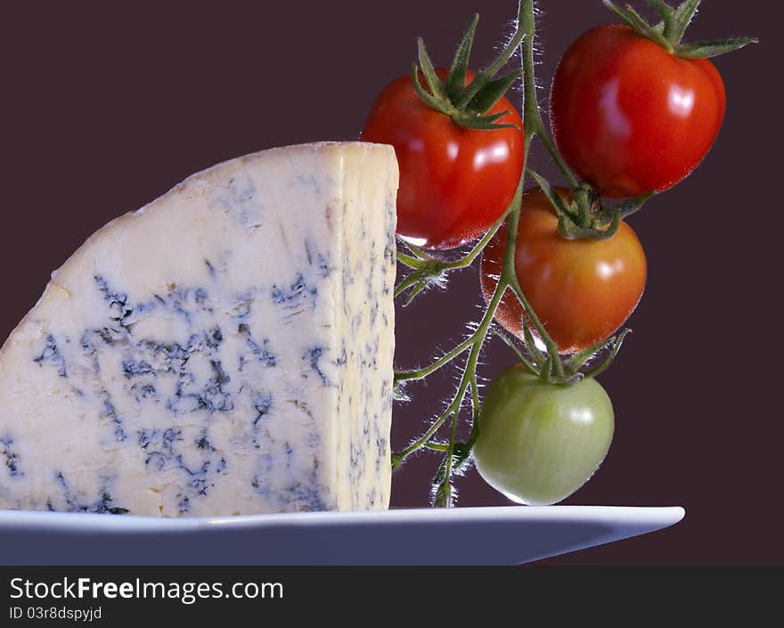 Slice of full fat soft blue cheese. Slice of full fat soft blue cheese