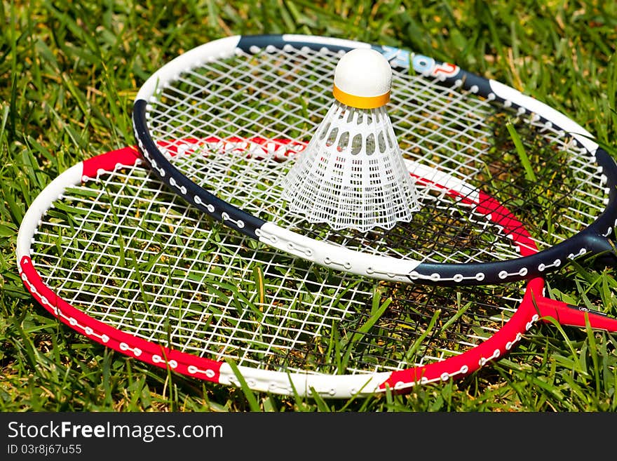 Two badminton rackets and shuttlecock closeup