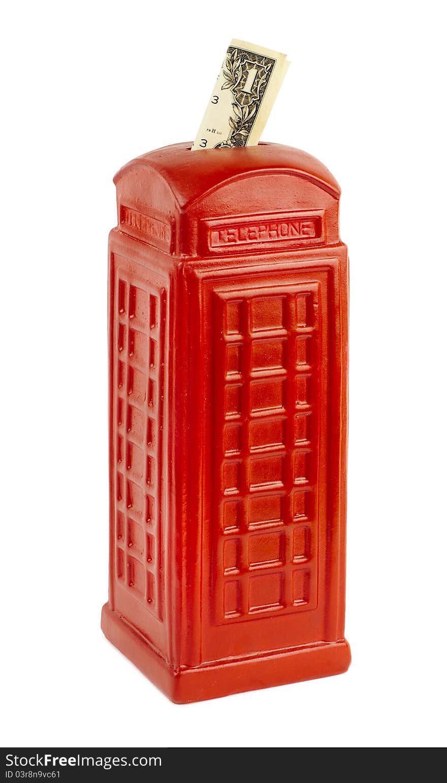 Red piggy bank in the shape of a classic English phone booth. Red piggy bank in the shape of a classic English phone booth