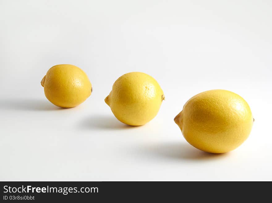 Three lemons on clean white background