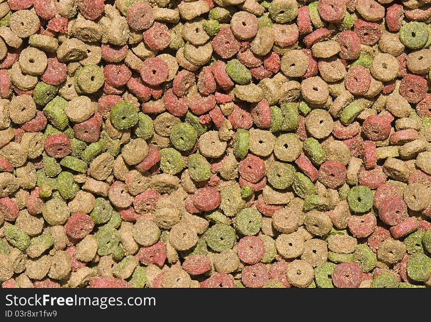 Background of dry cat food, small nuggets of colors. Background of dry cat food, small nuggets of colors