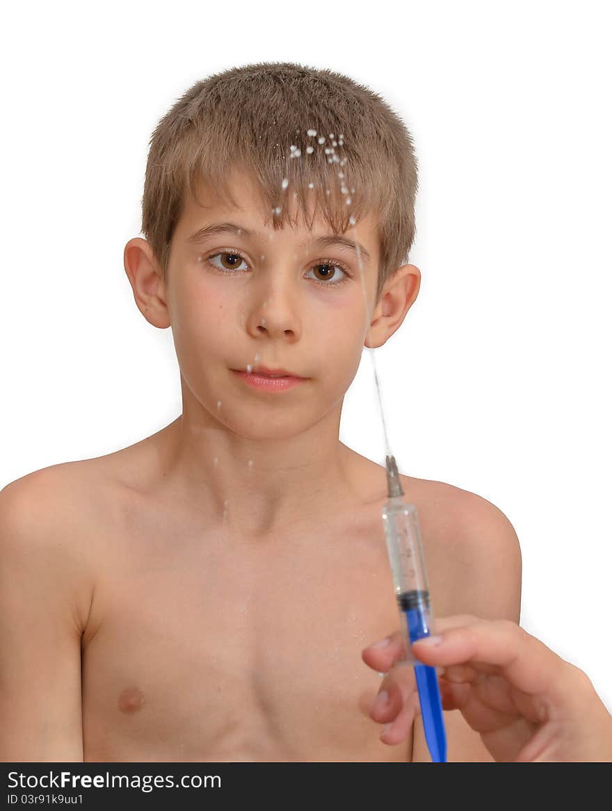 The boy and the syringe. Isolated on white background