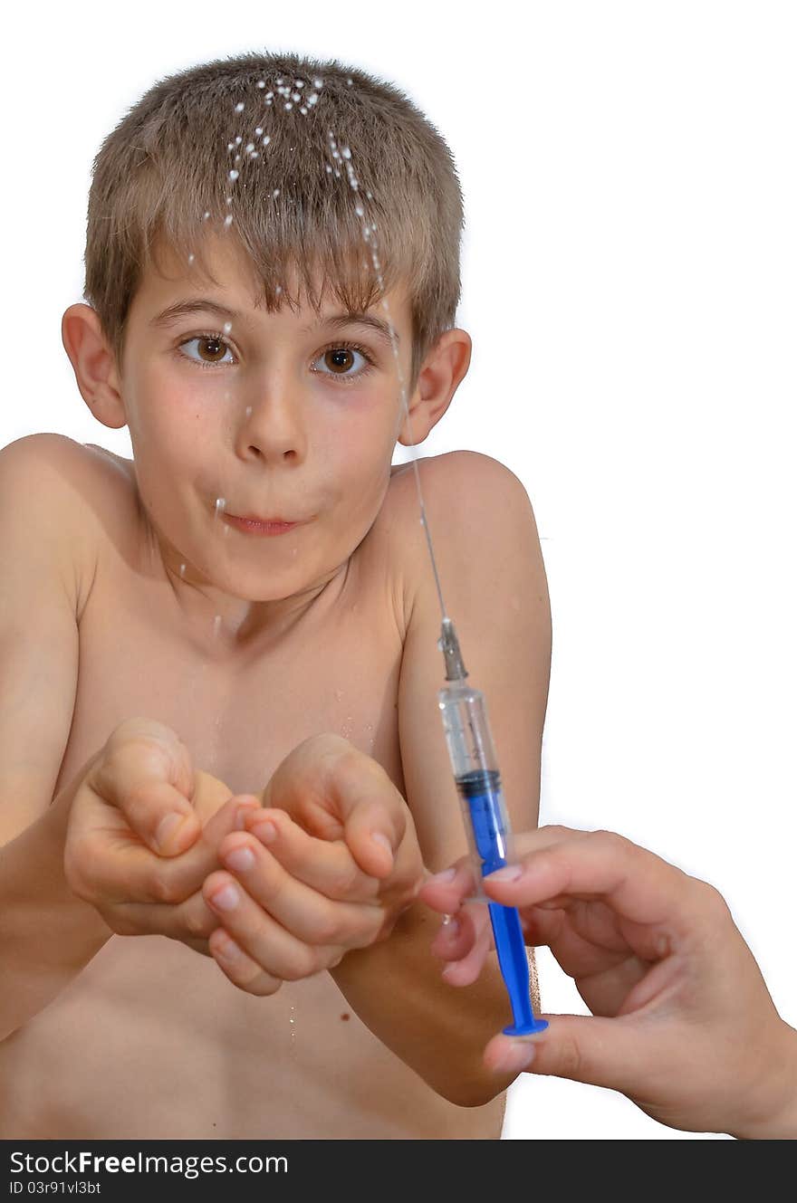 The boy and the syringe. Isolated on white background