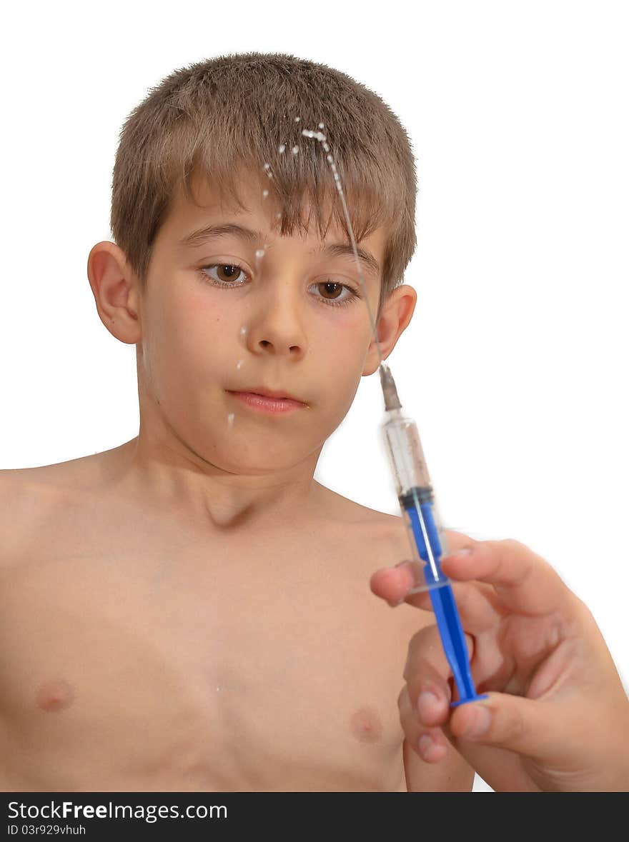 The boy and the syringe. Isolated on white background