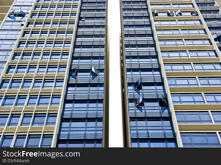 Huge resident apartment building with blue glass