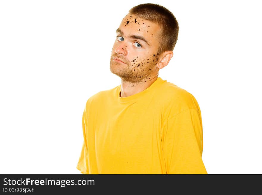 Handsome young man, his face and hands stained the ground. Guy pleased his hands raised up. Isolated. Handsome young man, his face and hands stained the ground. Guy pleased his hands raised up. Isolated