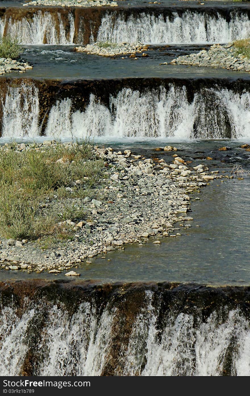 Spring water cascades on a mountain river