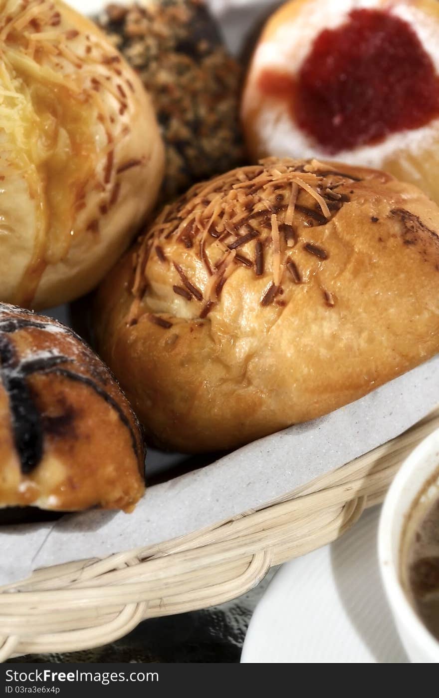 Bread in a basket with morning light. Great images for food and beverages article or any design involving food and drinks. Bread in a basket with morning light. Great images for food and beverages article or any design involving food and drinks.