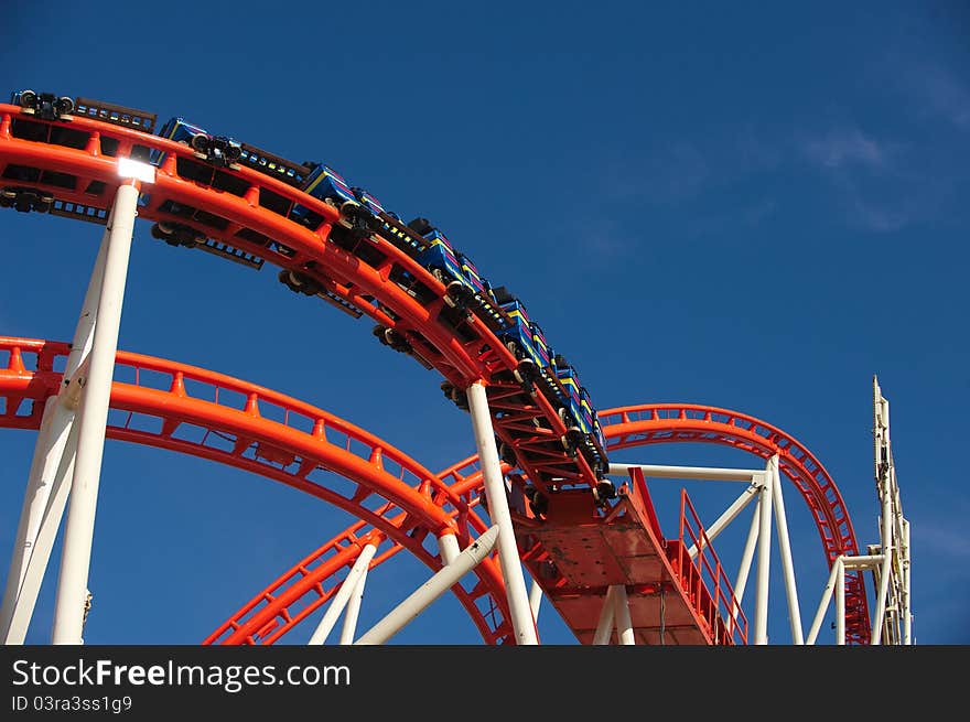 Roller coaster construction with the rails, trolley and lamps