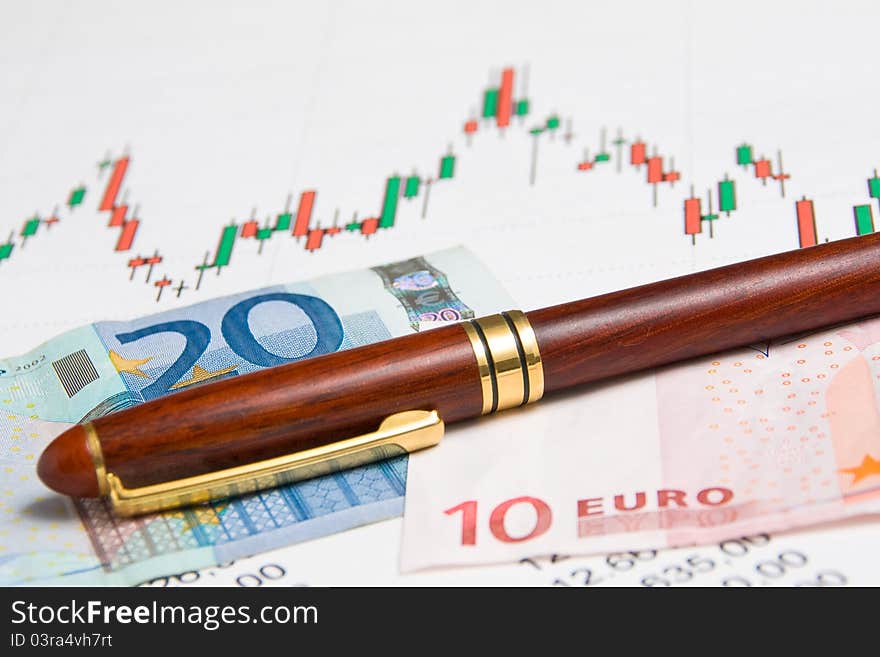 A graph exanche with euros and a pen in the background. A graph exanche with euros and a pen in the background