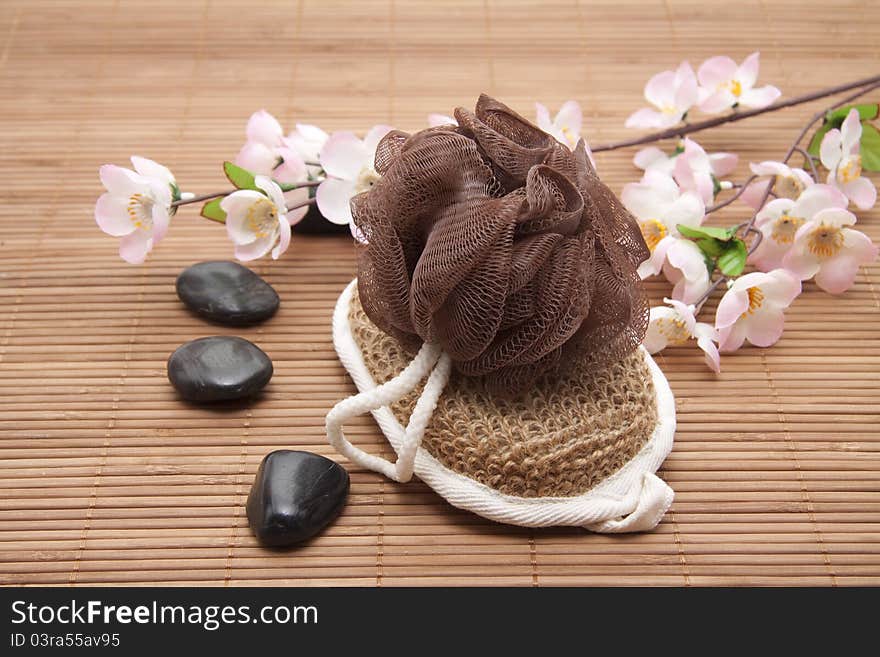 Massage sponge with belt and black stones