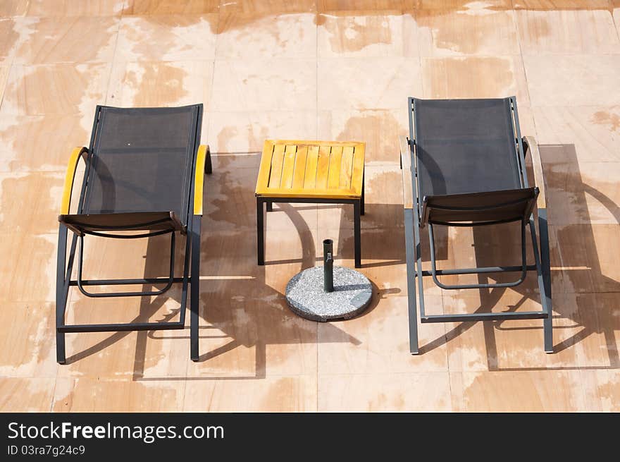 Rest chairs in a swimming pool on the wet floor. Rest chairs in a swimming pool on the wet floor