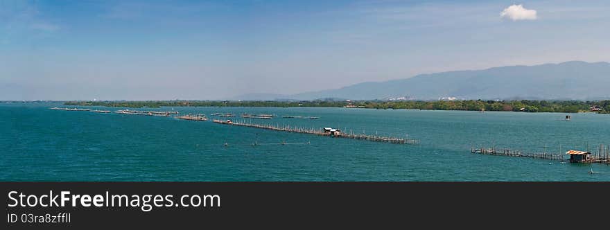 Long pier in blue seascape