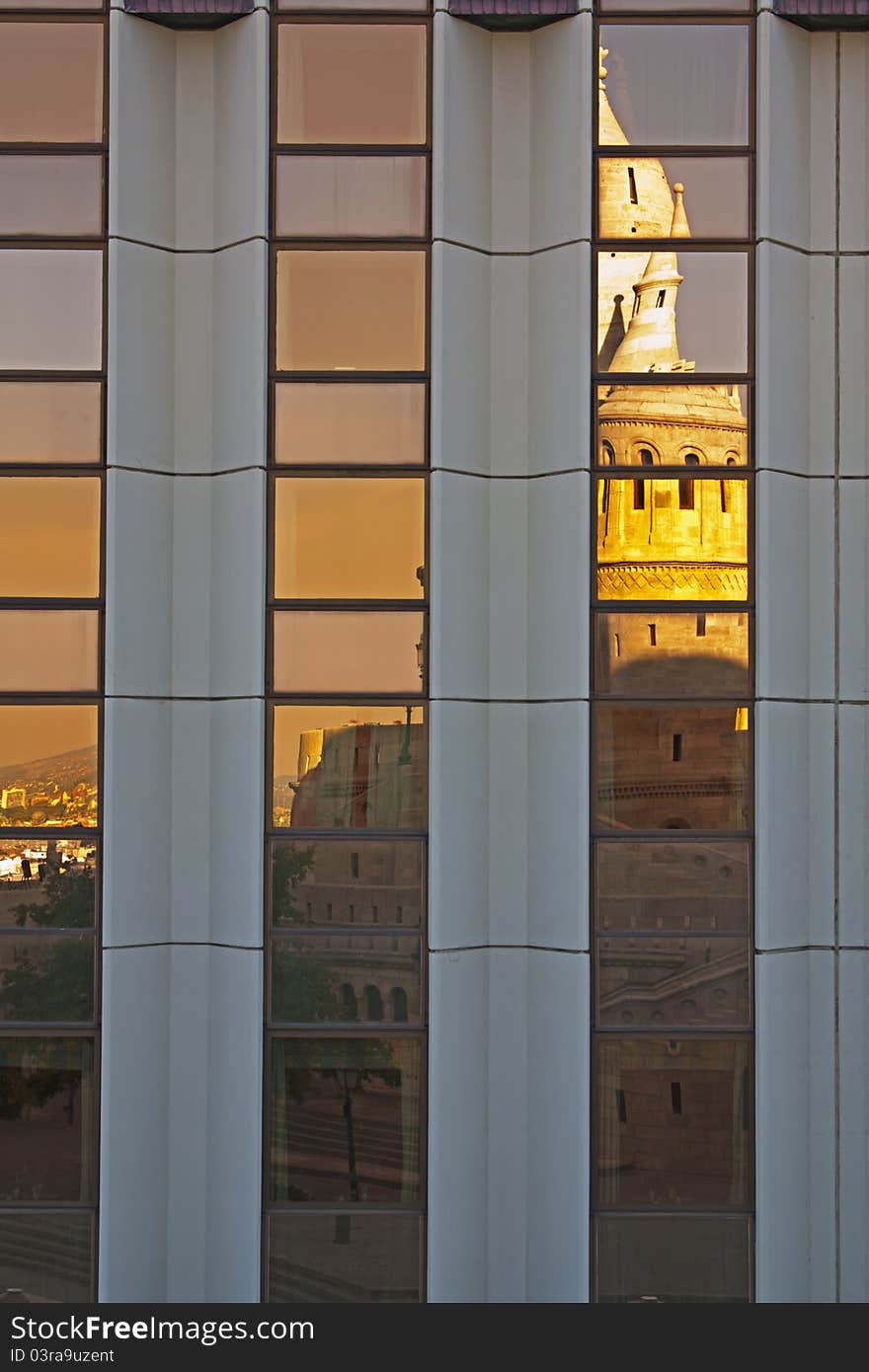 Fishermans Bastion reflected in windows of modern office building in Budapest Hungary. Fishermans Bastion reflected in windows of modern office building in Budapest Hungary