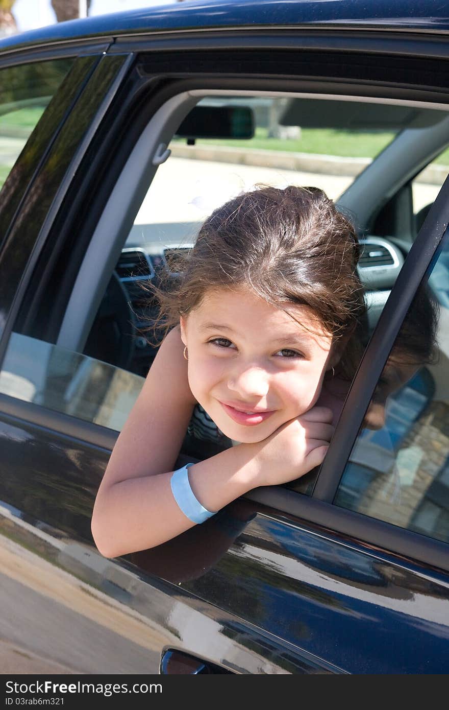 A Girl Looks Out The Car Window