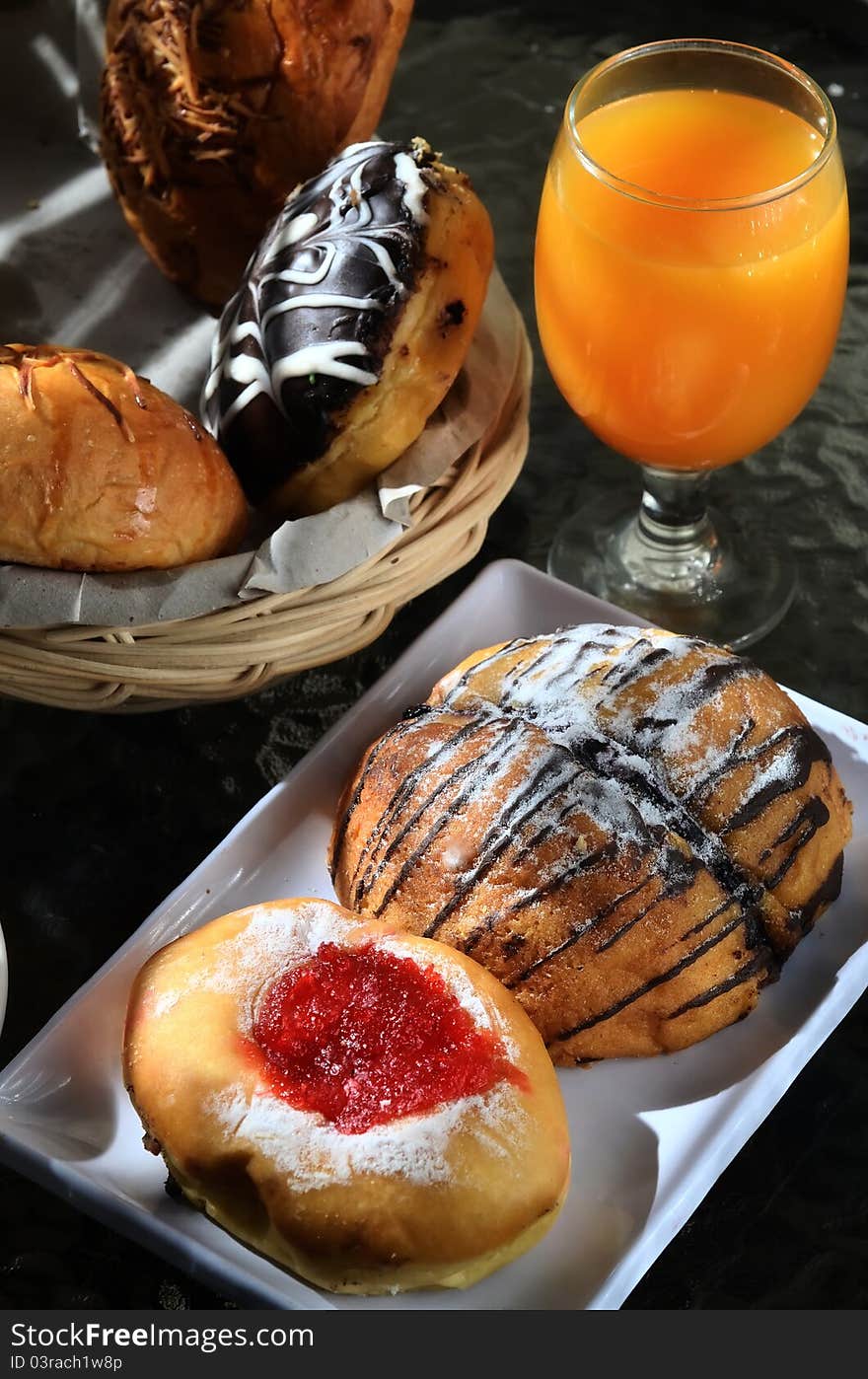 Bread and orange juice as breakfast menu