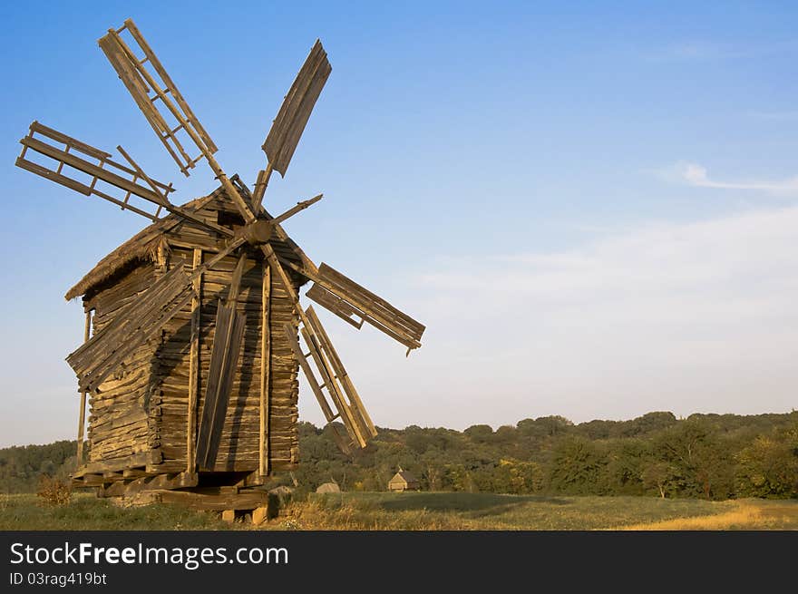 Old wooden windmill at sunset. Old wooden windmill at sunset