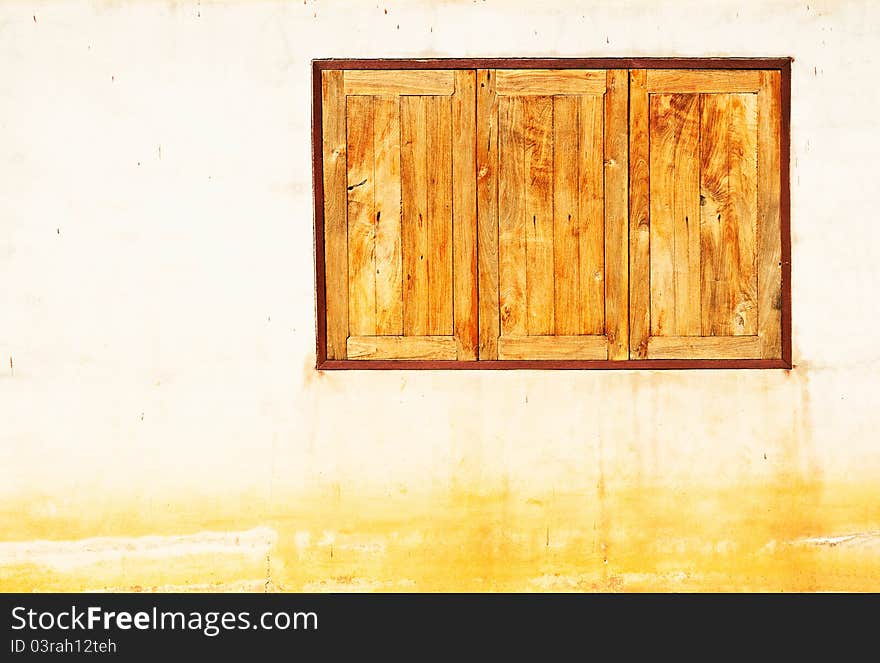 Wooden window on vintage wall background. Wooden window on vintage wall background