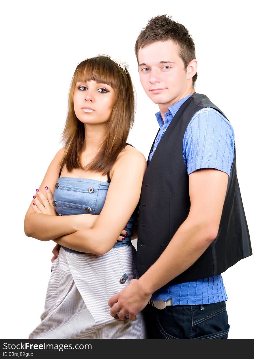 Portrait of a young handsome couple. Young men embraces women.