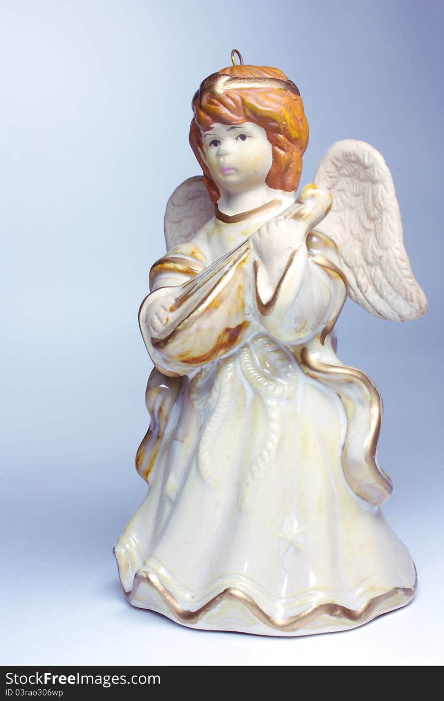 Figurine of an angel on a gray background