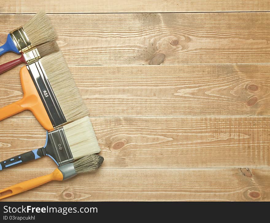 Different tools on a wooden background.