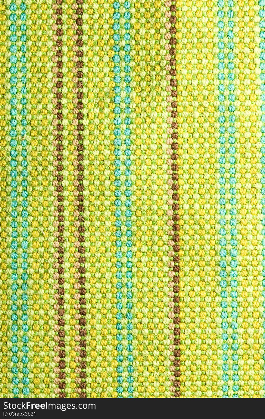 Textile background with colorful green, beige and yellow stripes