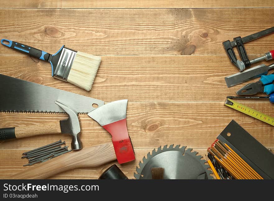 Different tools on a wooden background.