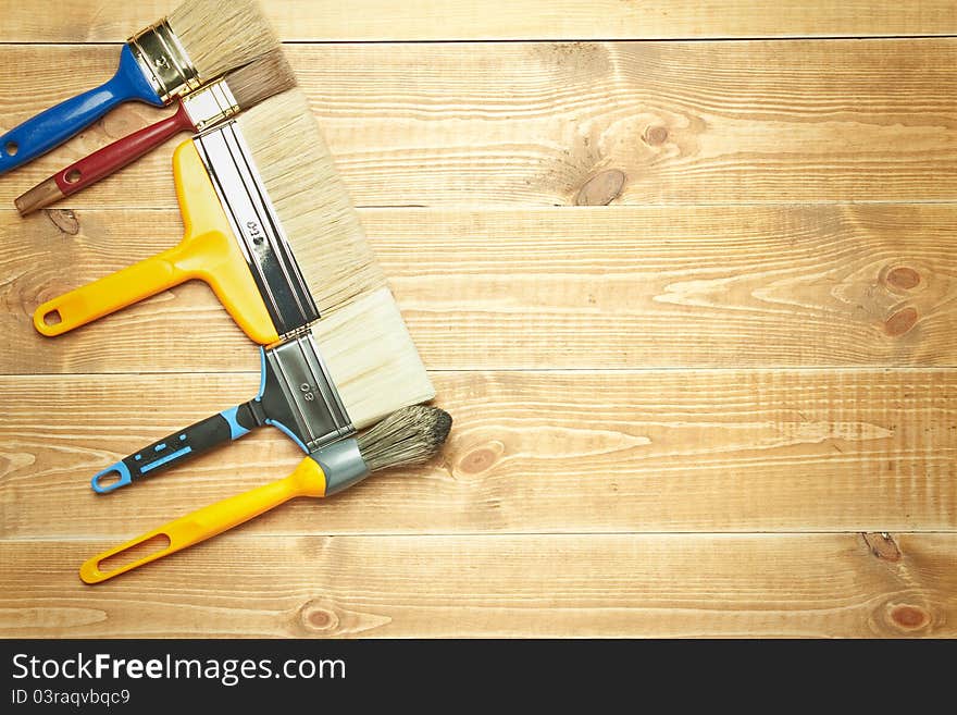 Different tools on a wooden background.